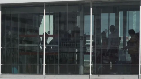 HD Jet bridge full of queuing travellers in line waiting to board plane Stock Footage 120134365