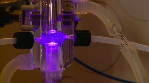 HD Luminescent liquid inside a flask Stock Footage 82618361