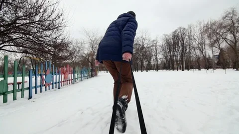 HD A man runs and pulls Sledge Stock-Footage 94325026