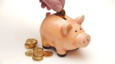 HD - Man throws a Coin in a Piggy Bank Video stock 35857582