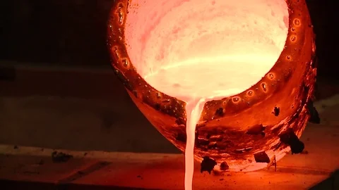 HD. Molten silver falling from a red hot pot Stock Footage