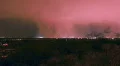 HD Night time fast moving storm cell lit up by city lights HD Footage