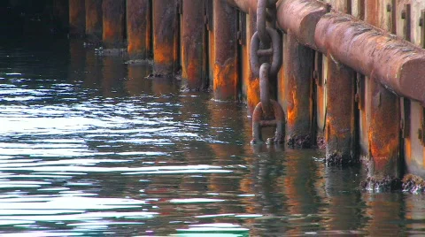 HD Old rusty chain on an abandoned timbered pier, closeup  Stock Footage 611803