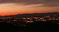 HD Pan right - Dusk timelapse of desert red skies and moving traffic lights HD Footage