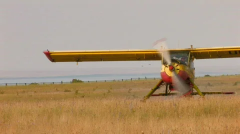 HD plane with propeller stands in the middle of the field Stock Footage 515780