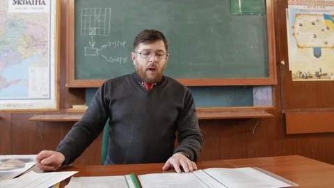 HD A professor is giving a lecture in a class room Video stock 97174621