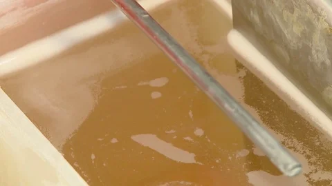 HD Putting ring in a solution Stock Footage 82618426