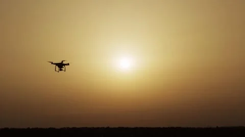 HD - Quadcopter drone on background of the Sun Stock Footage 64300945