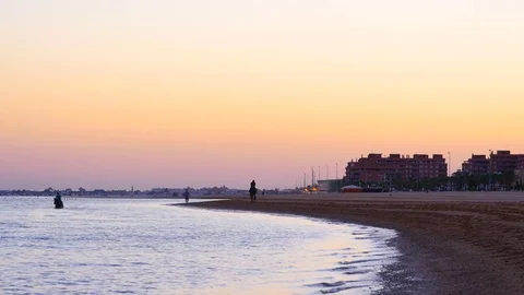 HD. Rider galloping along the edge of the beach at sunset Stock Footage 75421773
