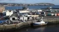 HD shot of boat in harbour, transport containers on dock HD Footage