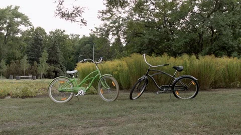 HD A shot of two bycicle standing nearby in the park Stock-Footage 94443682