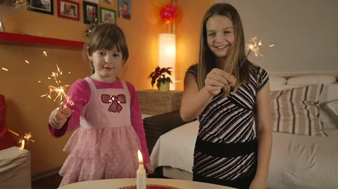 HD Slow-Mo: Sisters Lights Up the Sparklers 스톡 동영상 57753110