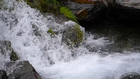 HD. Slow motion. Beautiful image of a thawing stream of Sierra Nevada in Granada Video stock 76976545