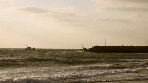 HD slow-motion shot of ocean waves gently rolling toward the shoreline. Stock Footage 341110001