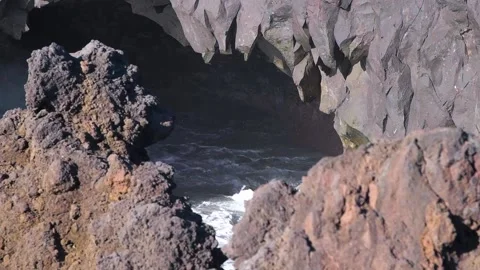 HD slow-motion shot, waves hitting sea cave with rainbow showing. Lanzarote Video stock 168346311