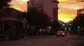 HD slow tilt up wide Colorful sunset clouds over downtown HD Footage