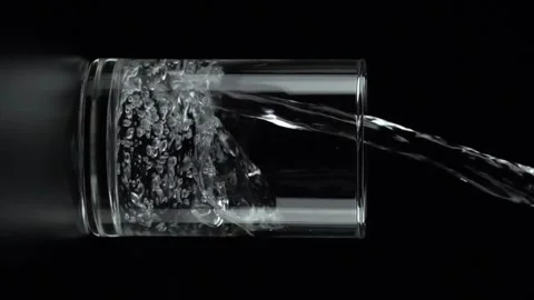 HD Super Slow-Mo: Pouring Wine In The Glass Pouring water into a full glass a Stock Footage 265845250