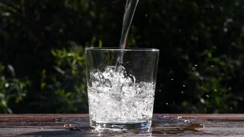HD Super Slow-Mo: Pouring Wine In The Glass Pouring water into a full glass a Stock Footage 265846780