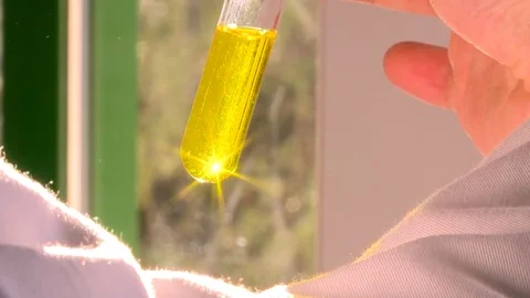 HD Test tube with a yellow solution Stock Footage 82618494