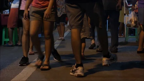 HD time lapse close up of local foot traffic at a night market, Thailand Stock Footage 95434147