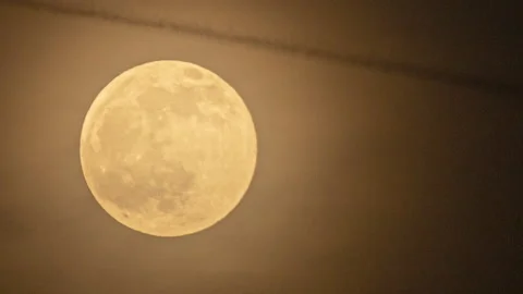 HD time lapse of a full moon rising through light cloud Stock Footage 181549429
