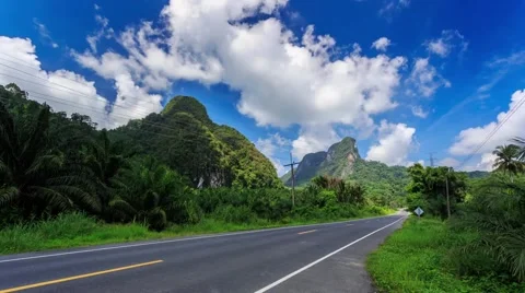 HD Time lapse. Mountain Road, moving clouds Stock Footage 40728337