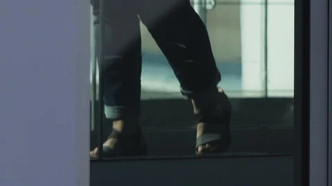 HD Travellers walk through shiny glass jet bridge toward airport terminal V4 Stock Footage 120135346
