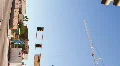 HD vertical Building crane wobbles and rotates with cam pan in timelapse Video HD