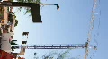 HD Vertical format Building crane wobbles and rotates in timelapse HD Footage