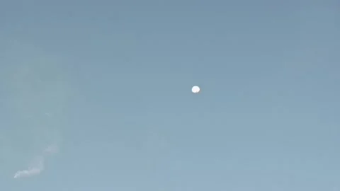 HD video of the moon in the sky, as evening approaches. Stock Footage 311935529