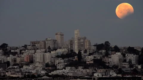 HD Video partial Lunar Eclipse moon setting over San Francisco, CA Stock Footage 154916841