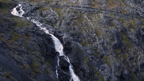 HD Waterfall off of Cliff in Slow Motion in Norway, Pan Down Aerial Perspective Видео 81073929