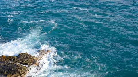 HD Waves breaking against a rock Stock Footage 82619463