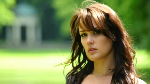 HD720p Young sexy brunnete fashion woman outdoor in the garden looking Stock Footage