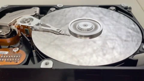 HDD data recovery concept disk spinning cyber security protection Stock Footage 235484345