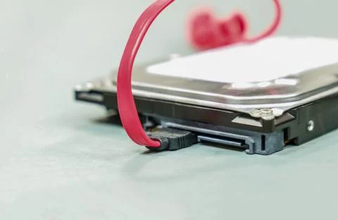 Hdd disk and red sata cable for data storage and close-up photo Stock Photos