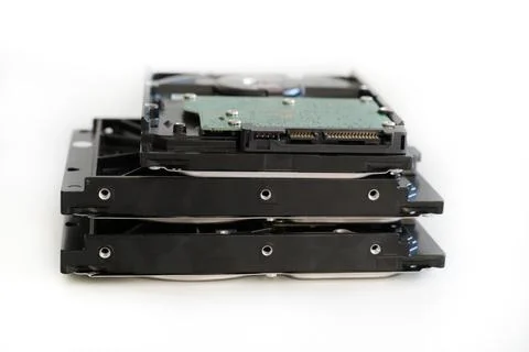 Hdd disk with green microchip close-up stacked in a pile on isolated backgrou Stock Photos