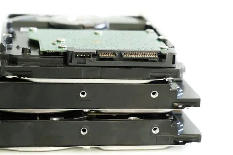 Hdd disk with green microchip close-up stacked in a pile on isolated backgrou Stockfoto's