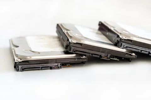 Hdd disk repair on a light background data storage stacked in a row Stock Photos