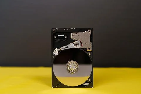 Hdd disk on yellow black background Stock Photos