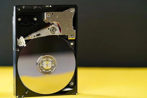 Hdd disk on yellow black background Stock Photos