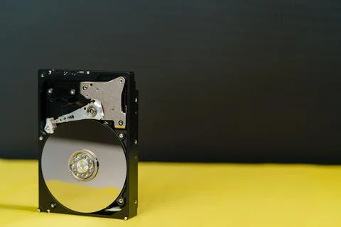 Hdd disk on yellow black background Stock Photos