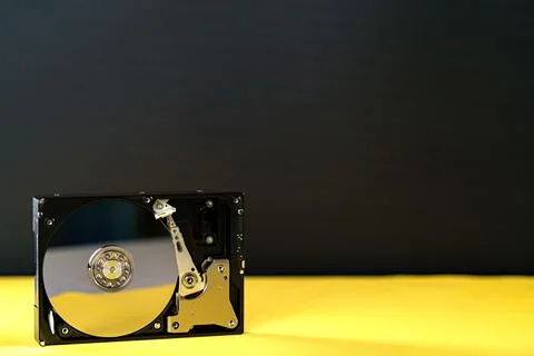 Hdd disk on yellow black background Stock Photos