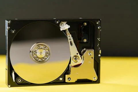 Hdd disk on yellow black background Stock Photos