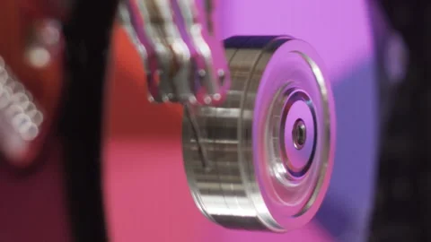 HDD head moving over platters with colorful reflections. Disassembled data disk Stock Footage 204944222