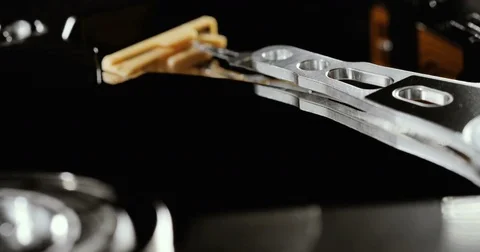 HDD reading and writing data. Operating hard disk drive on dark background. Stock Footage 78792636