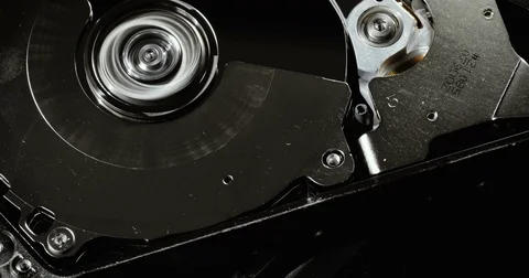 HDD reading and writing data. Operating hard disk drive on dark background. Stock Footage 78796529