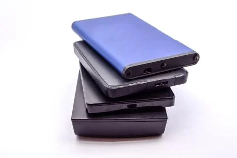 HDD - Stack of Portable Hard Disk Drives isolated on white background. Pile o Stock Photos