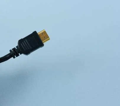 HDMI cable for TV computer and video on blue background Stock Photos