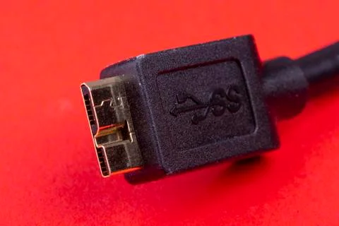 Hdmi data cable extension on red background Stock Photos